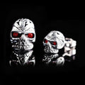 Retro skull stud earrings with red eye ghost head design on alloy construction