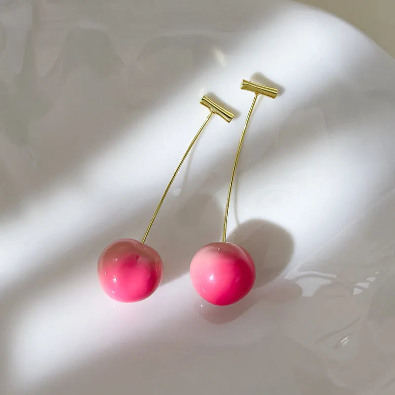 Acrylic peach fruit earrings showing small and large size options with copper findings