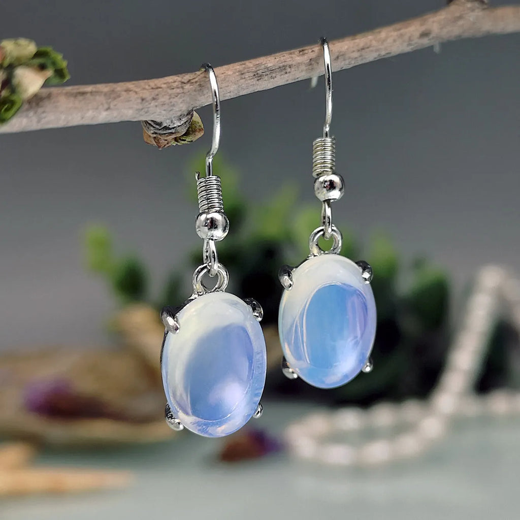 Moonlight white opal drop earrings with retro moonstone design and cross motif on alloy
