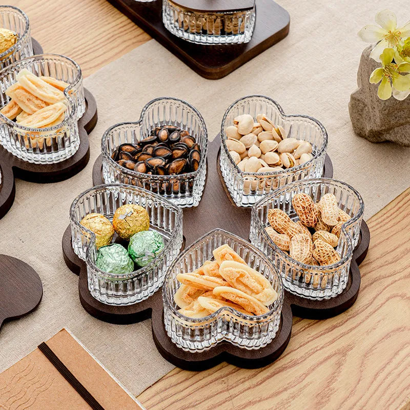 Glass retro-style serving platter with heart-shaped transparent lid and multiple food compartments.