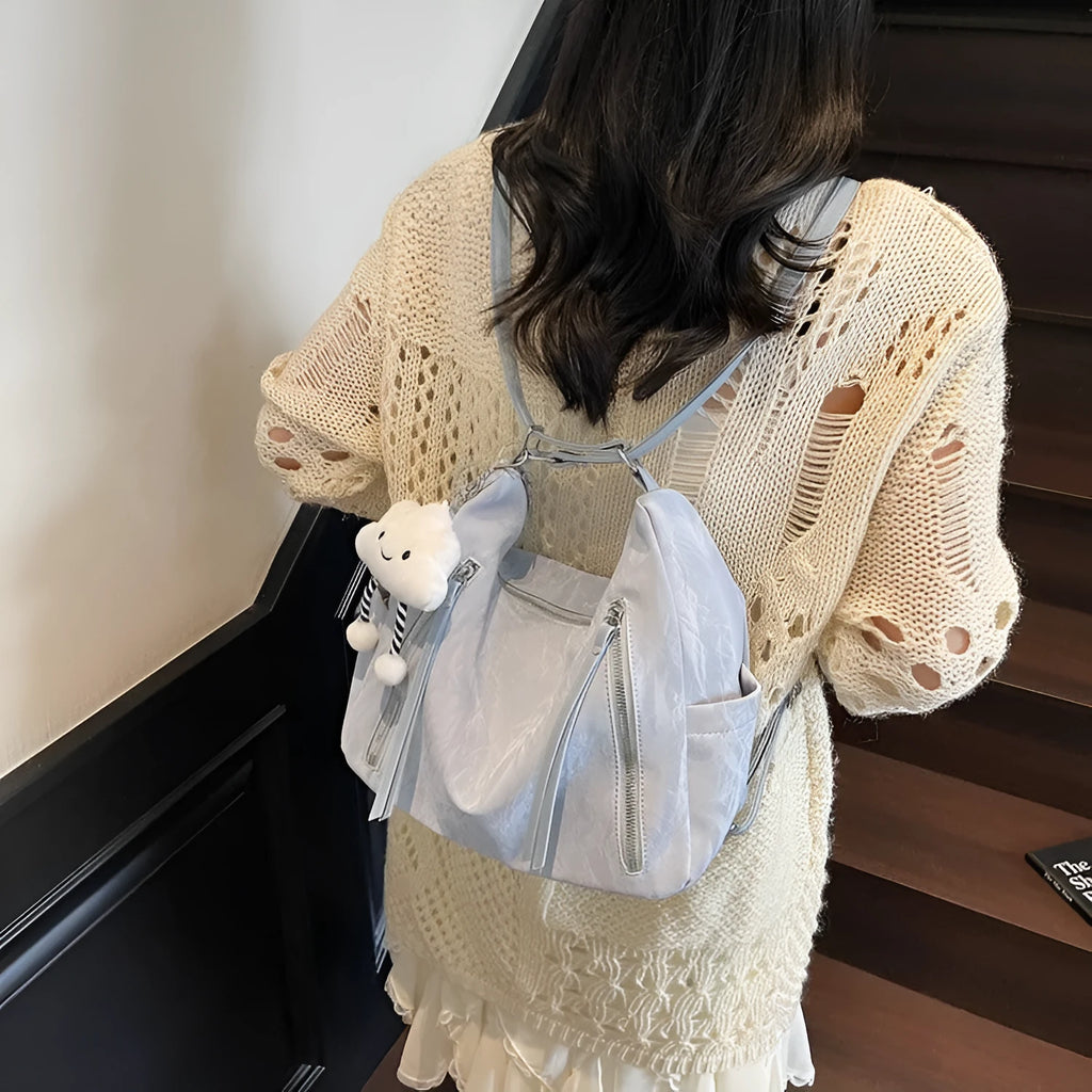 Women's soft PU fashion backpack in four colour options with pendant accessory