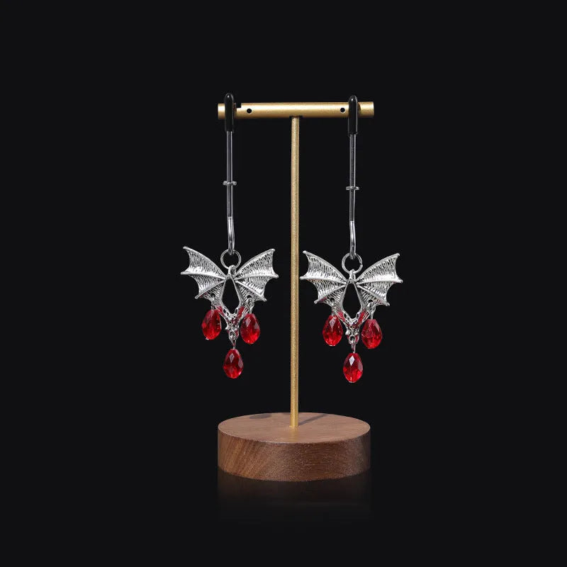Silver bat nipple clamp with adjustable ruby clip for clitoral stimulation