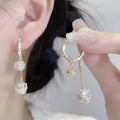 Silver women's earrings with balloon and rhinestone pendants in drop shape design.