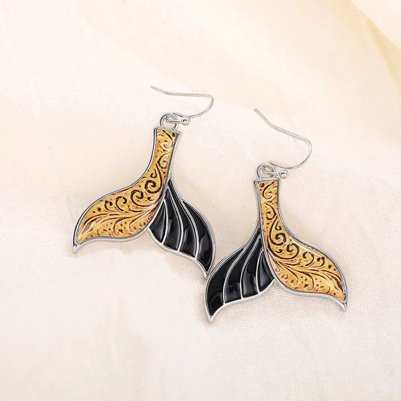 Women's retro whale fishtail alloy earrings in white gold colour, approximately 3cm length