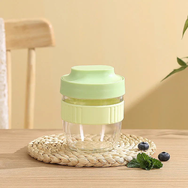 Green, purple, white, and pink plastic salad cups with lids and spoons in small and large sizes.