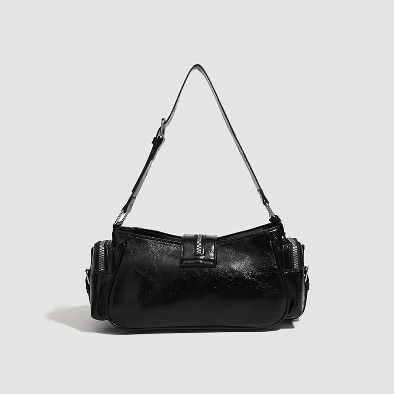 Black retro dumpling-shaped handbag with oil wax leather finish and three-dimensional pocket design