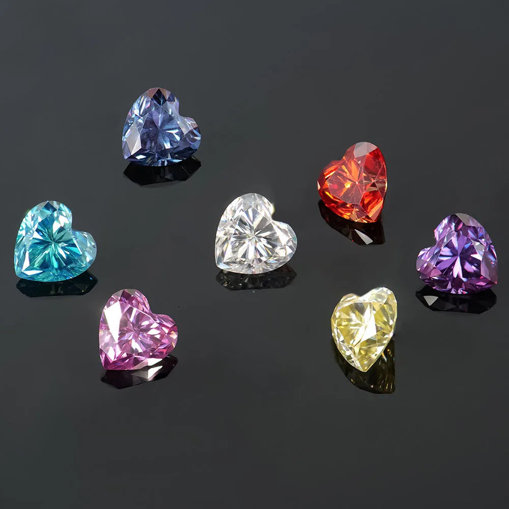 Lemon yellow heart-shaped moissanite gemstone measuring 11mm by 11mm on a plain background.