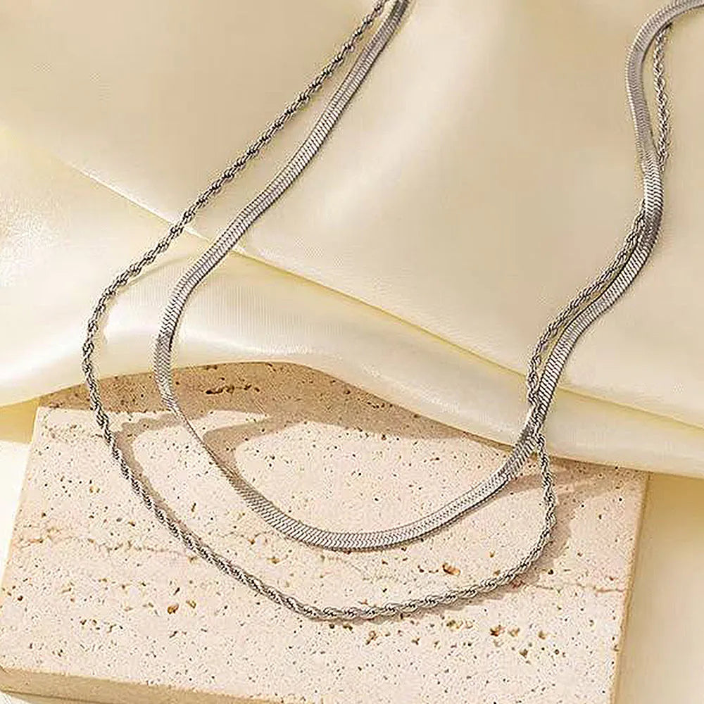Close-up of a women's retro geometric line double-layer twist necklace with an adjustable stainless steel chain.