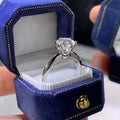 White gold plated six-claw zircon ring on a geometric white copper band.