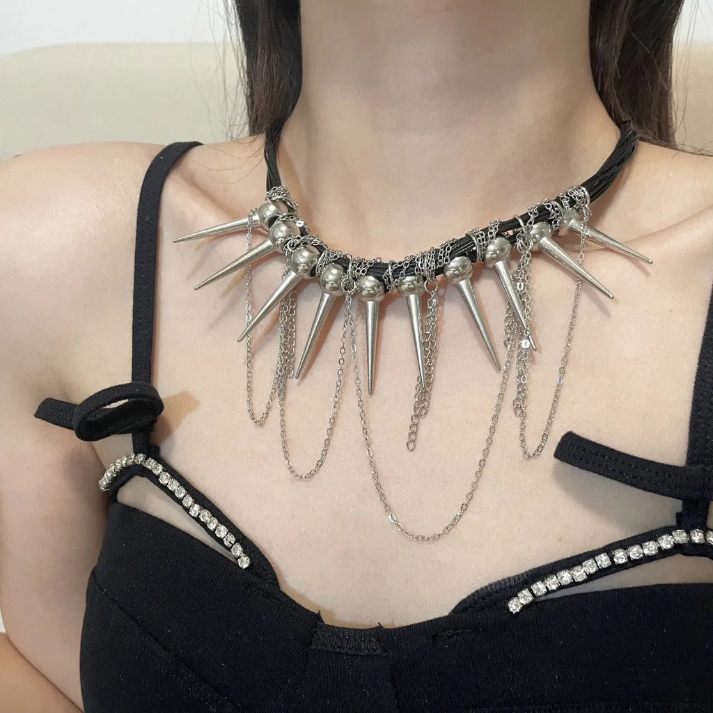 Leather necklace with round beads and winding tassel design featuring point rivet details