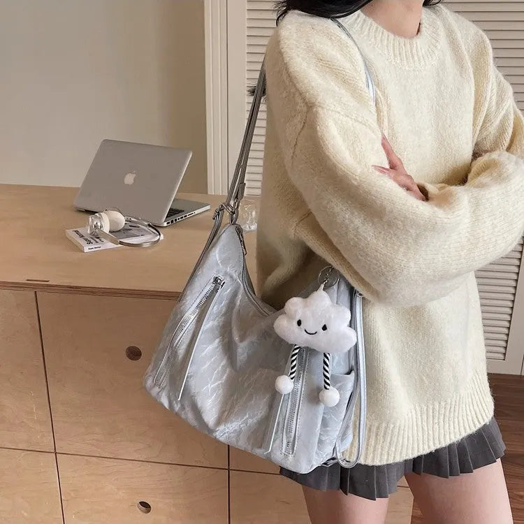 Women's soft PU fashion backpack in four colour options with pendant accessory