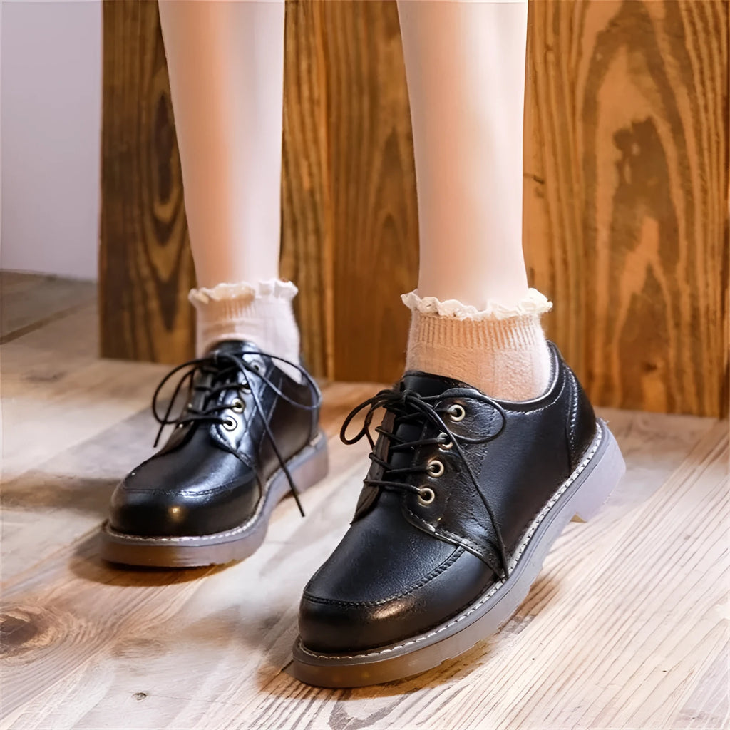 Women's preppy retro mary jane shoes in black with front lace-up design and low square heel