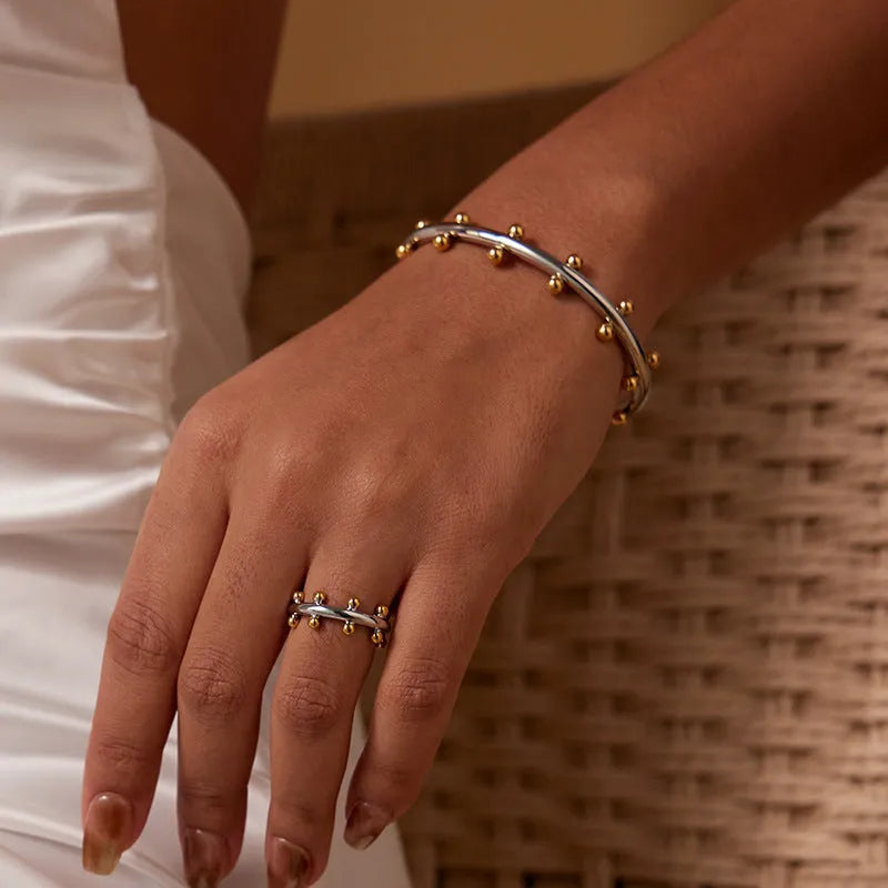 Stainless steel C-shaped bracelet with rivet bean bead texture in gold, steel, or steel gold colour