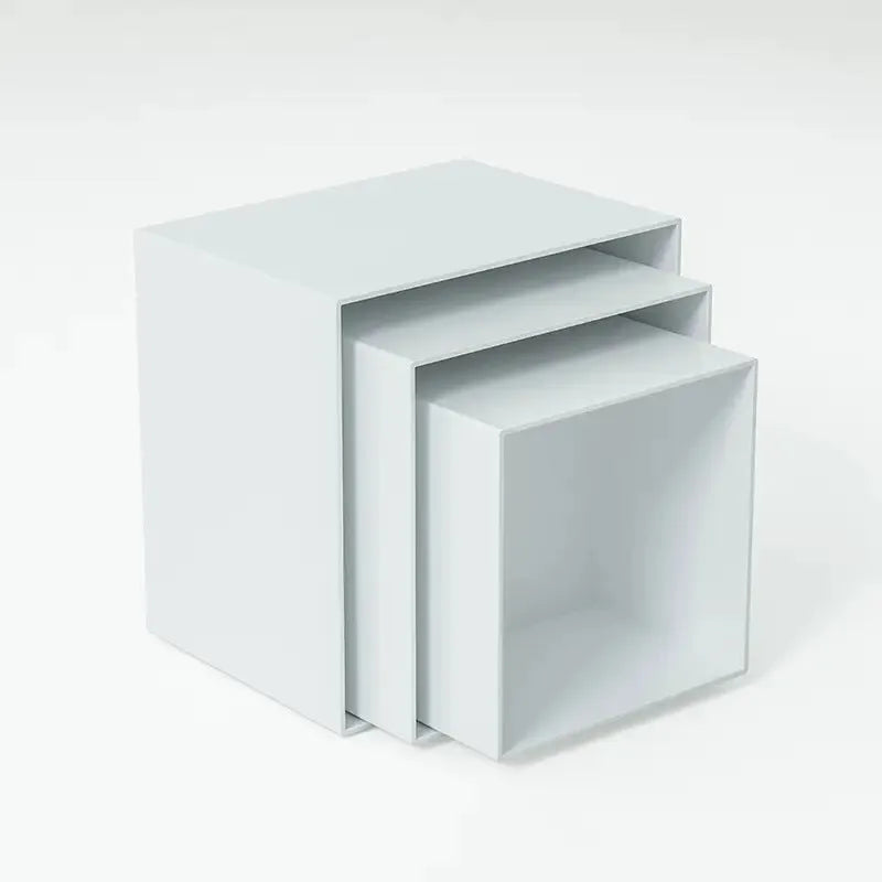 White plastic Suit Cube dessert display stand with six modular pieces arranged in multi-level configuration