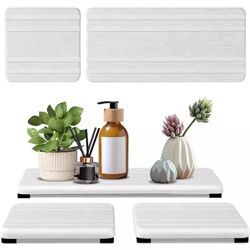 Set of three square bathroom countertop water draining pads in diatom oil material