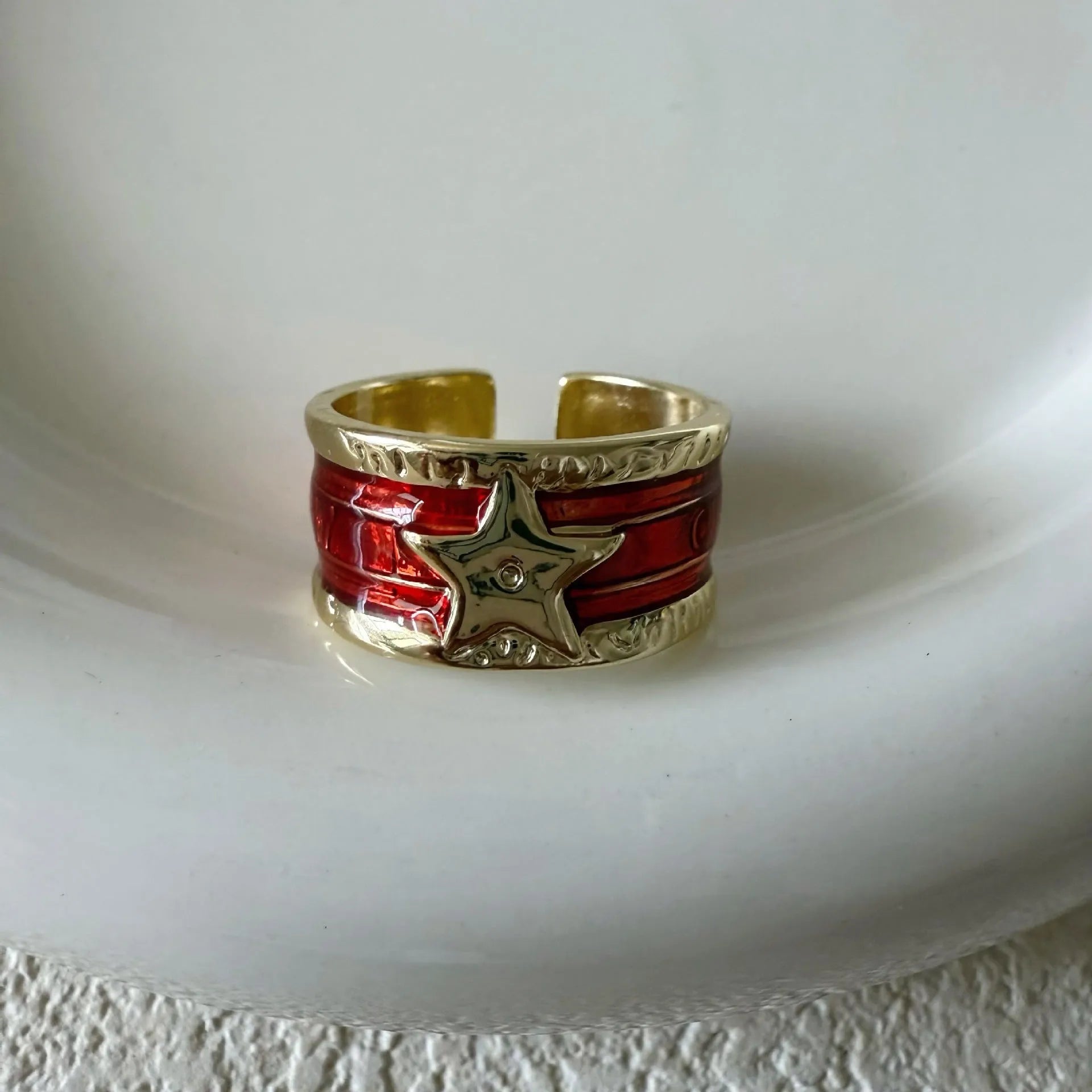 Adjustable geometric copper ring with distressed finish and XINGX drop oil design in selected colour.
