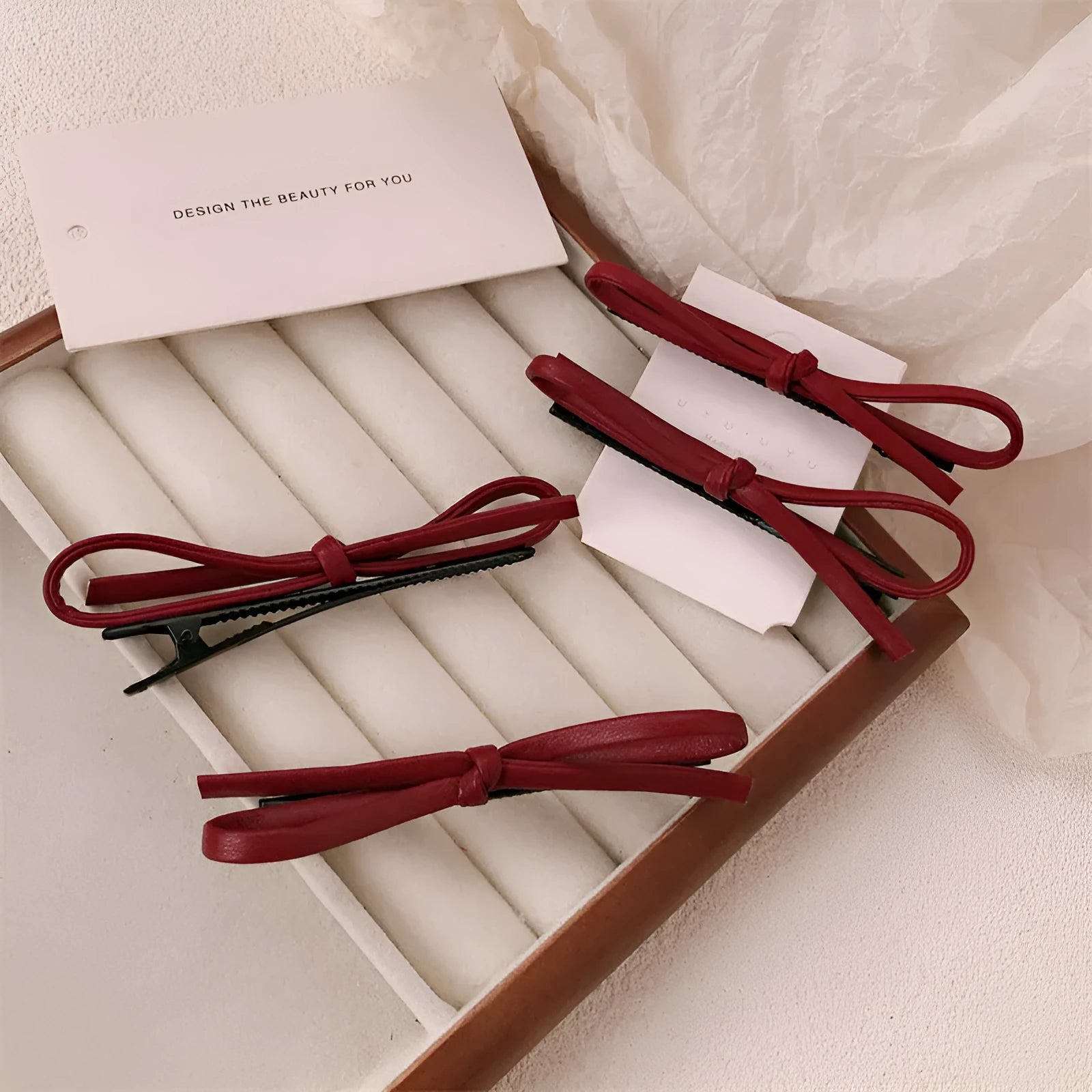 Wine red leather bow barrettes hair clips showing handcrafted bow design