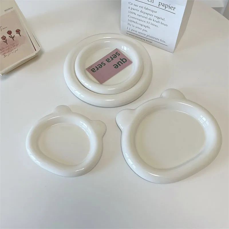 White ceramic plate with chubby toot bear illustration, porcelain potted tray.