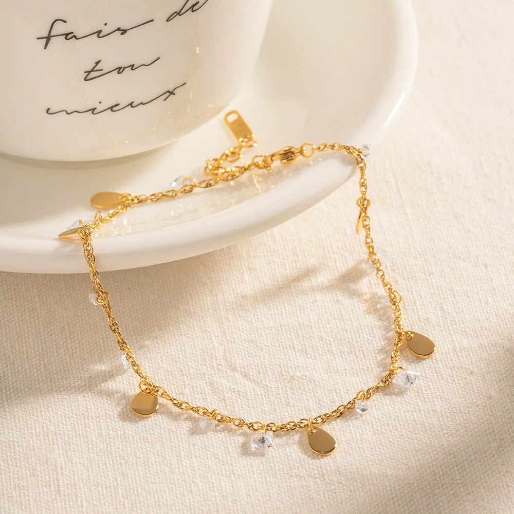 Women's stainless steel anklet with geometric water drop tassel design on adjustable chain