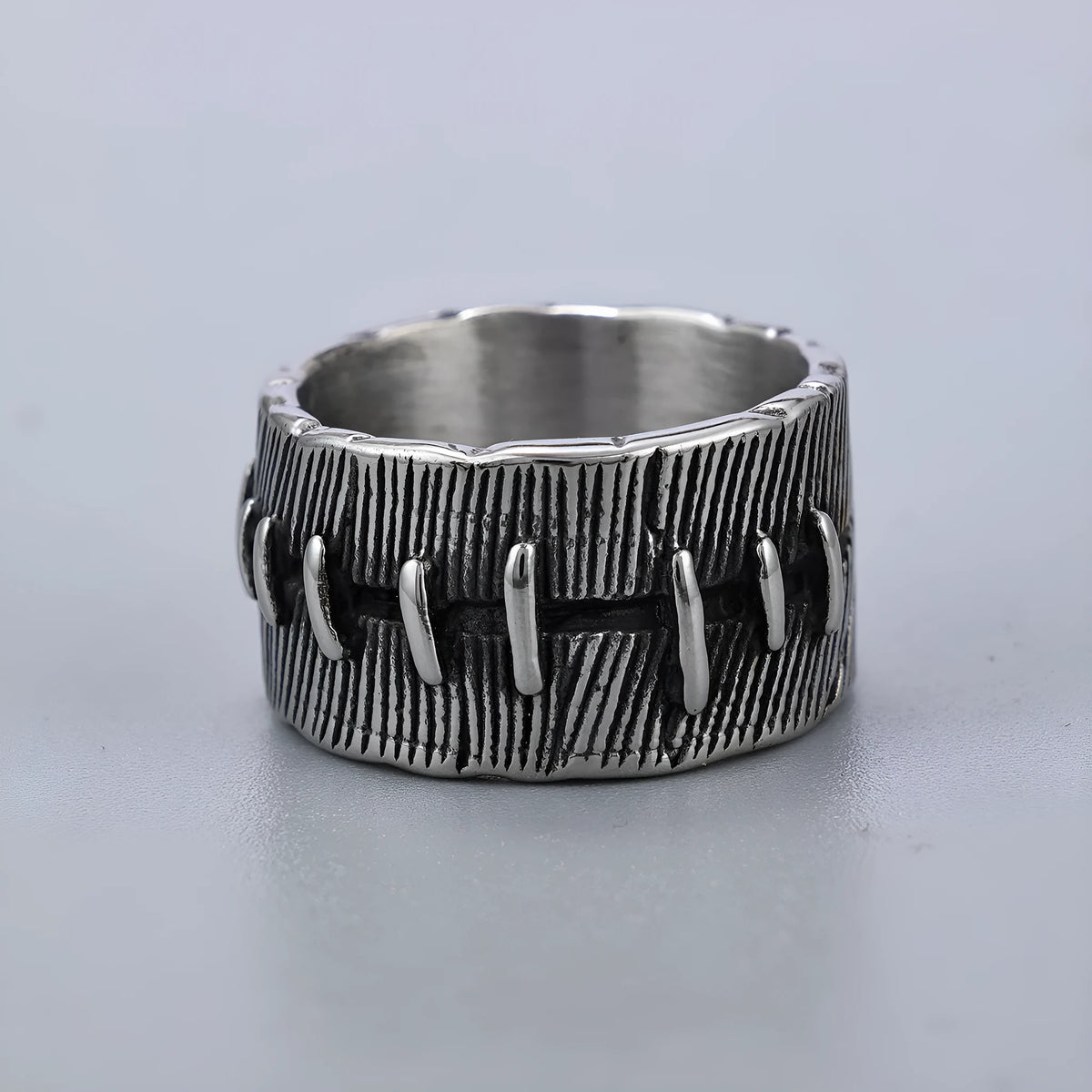 Titanium steel dark punk stitched ring with geometric U-shape design and double ring element in retro colour