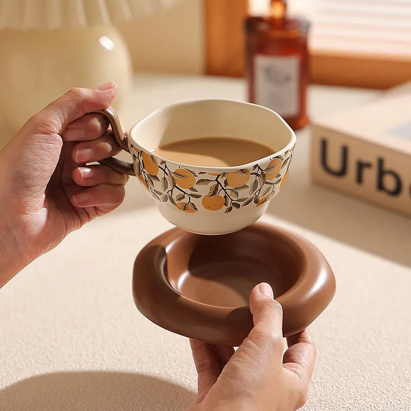 Antique style ceramic coffee cup and saucer set with 210ml capacity in black or orange retro design.