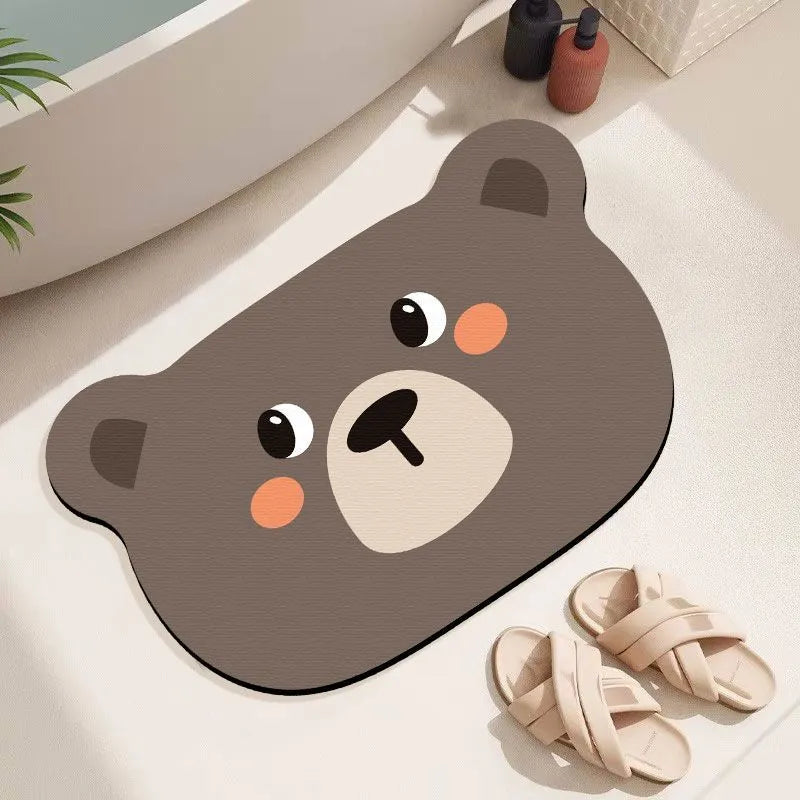 Cartoon animal diatomaceous earth bathroom mat in alien shape on a bathroom floor.