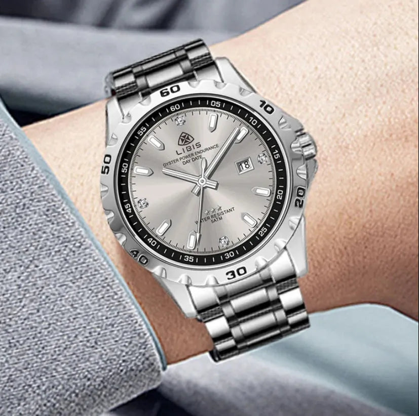 Men's silver quartz watch with luminous markers on black dial and stainless steel strap