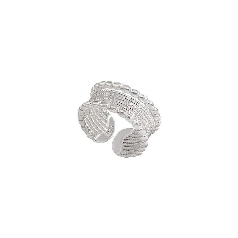 Geometric women's ring with adjustable opening and twisted woven copper alloy construction