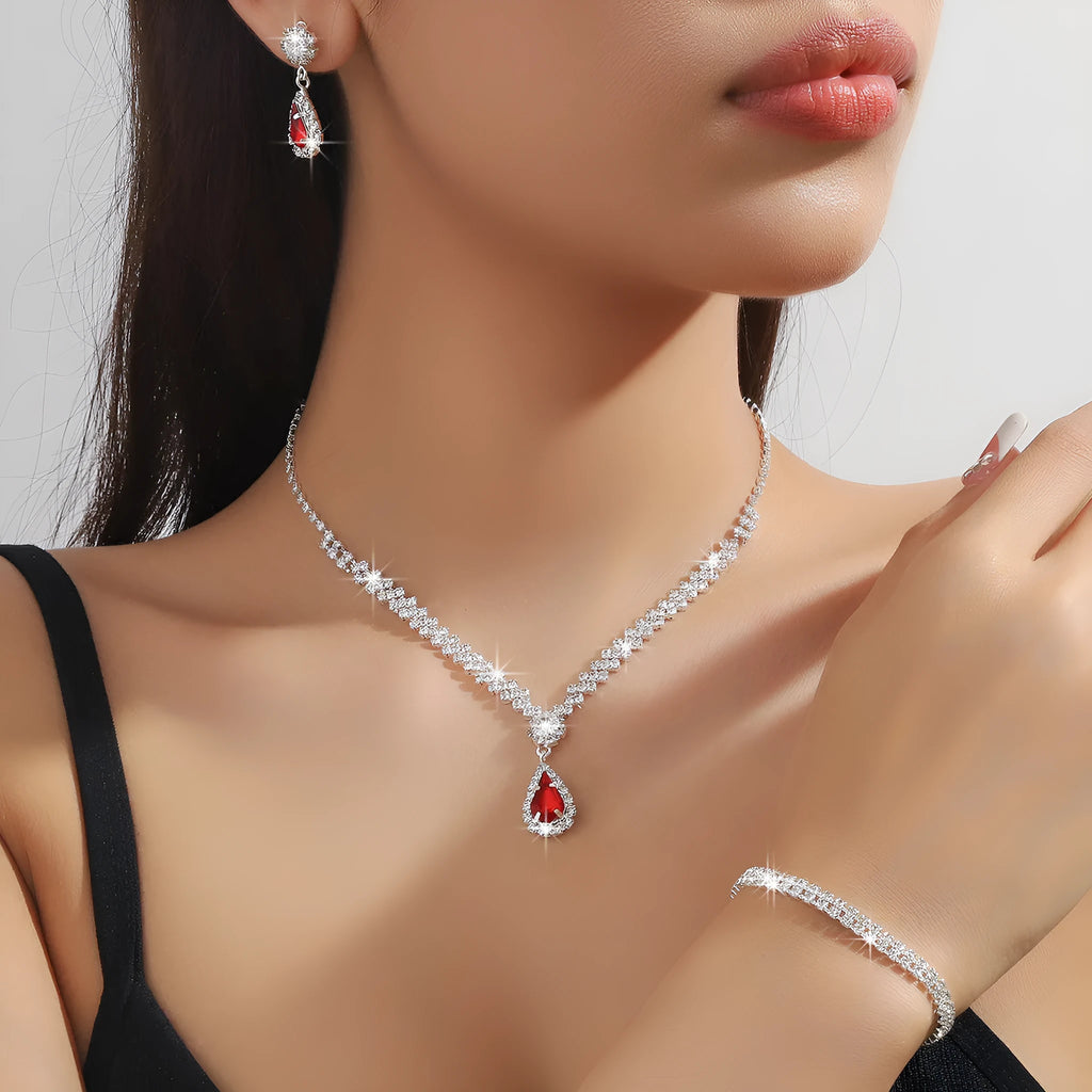 Claw chain necklace and earrings set with drop-shaped rhinestone pendants in multiple colour options