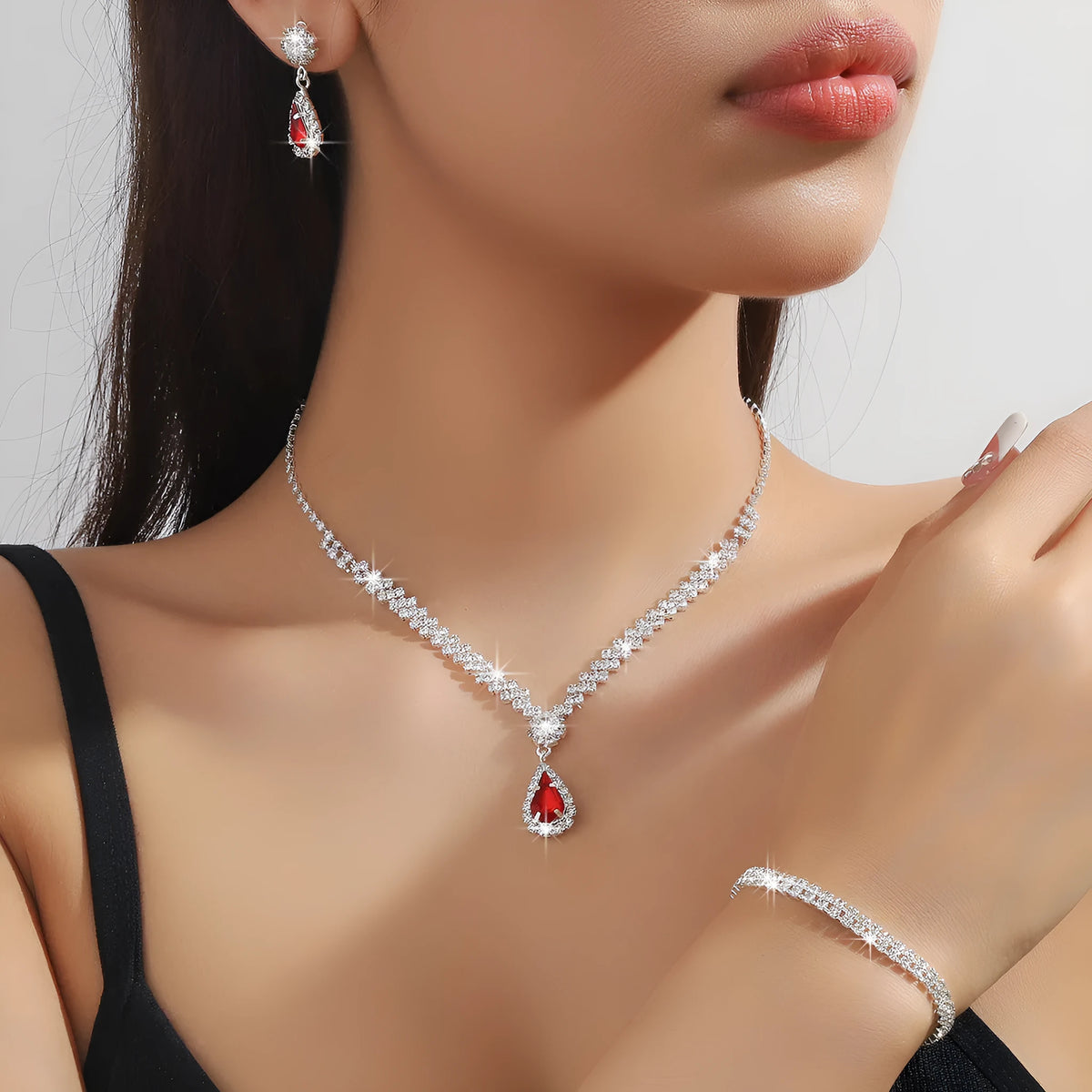 Claw chain necklace and earrings set with drop-shaped rhinestone pendants in multiple colour options