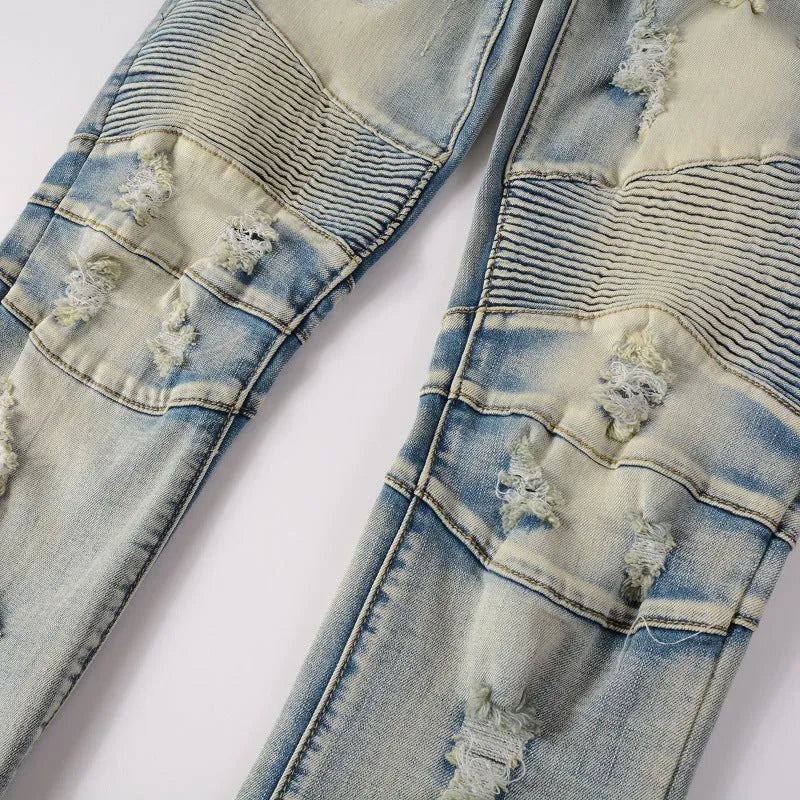 Light blue distressed men's slim-fit jeans with hand-frayed details on a mid-waist, straight-leg stretch denim.