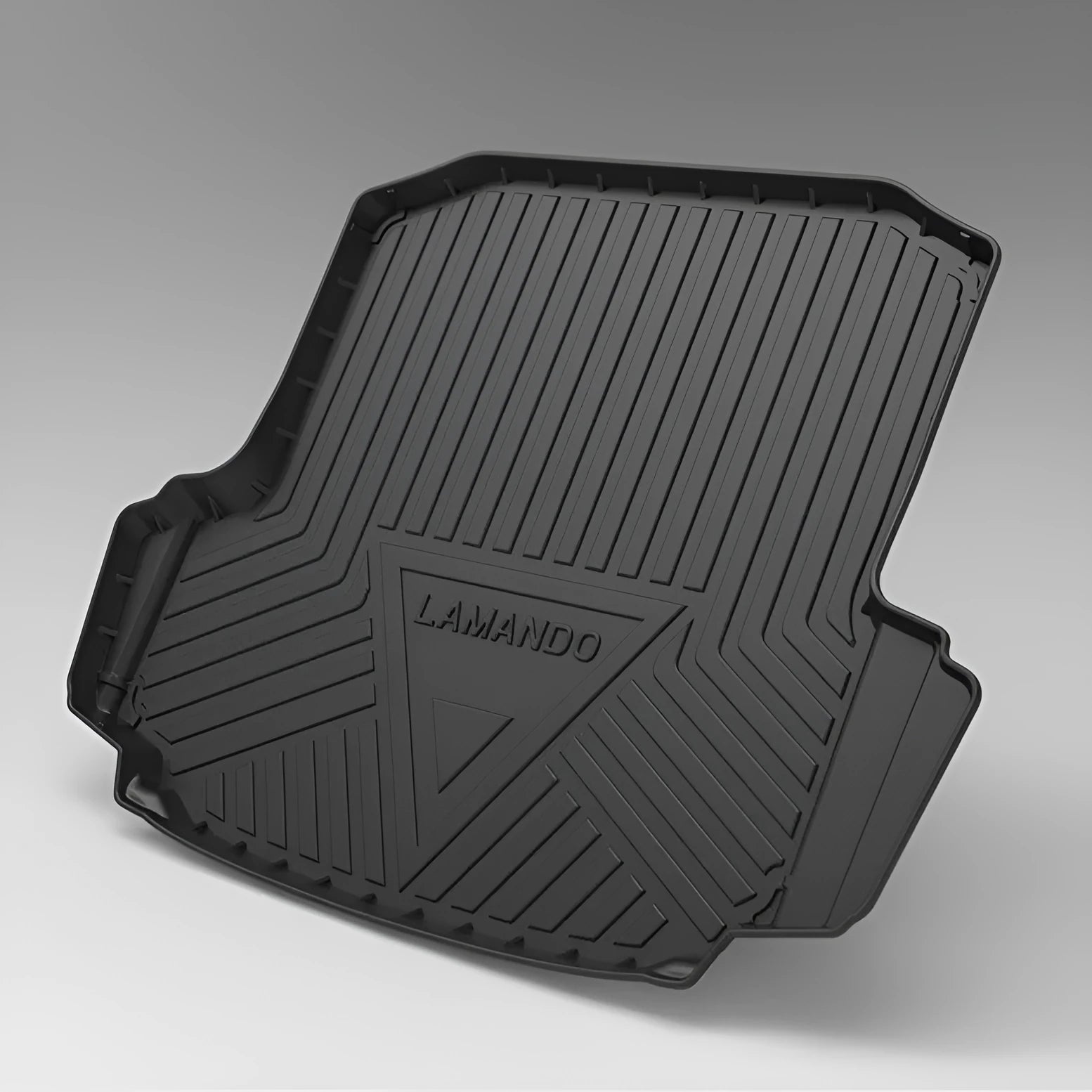 Black TPE car boot liner with carbon fibre pattern texture, shown fitted in a vehicle trunk.