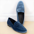 Blue leisure loafers with a black rubber sole, shown in a plus size range.