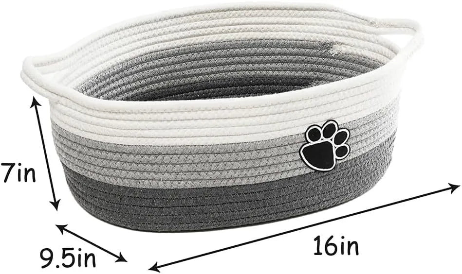 Handmade light beige woven cotton rope storage basket with wood and a handle.