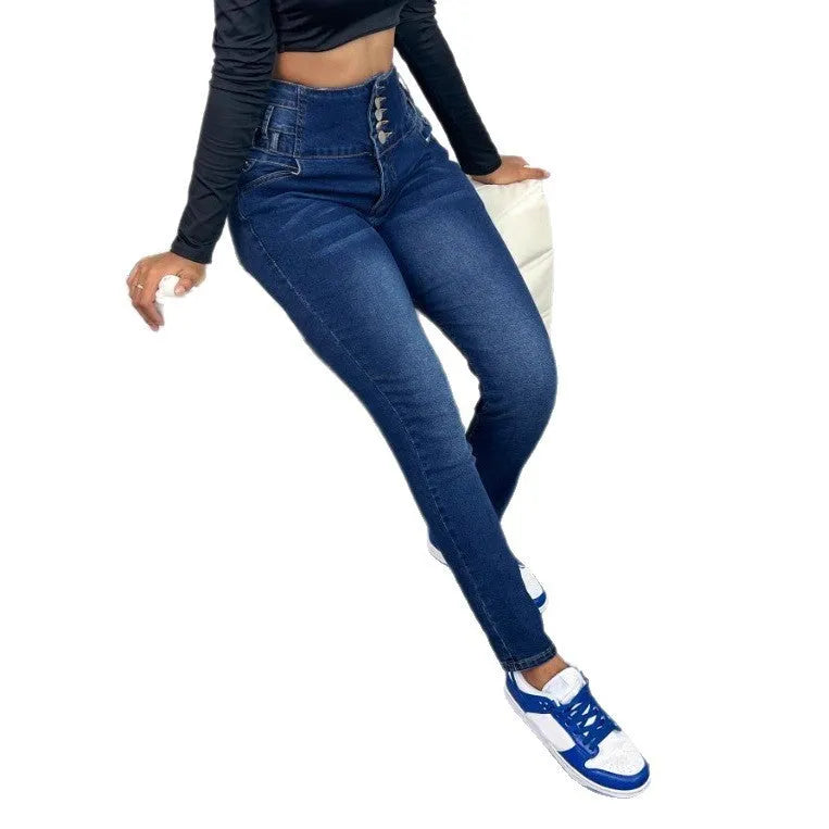 Dark blue women's straight-leg denim trousers with breasted button fastening on a hanger.