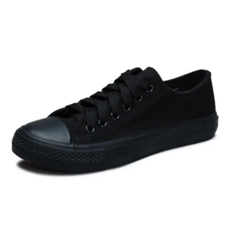 Women's solid colour canvas casual shoes on a plain background, showing the simple design.