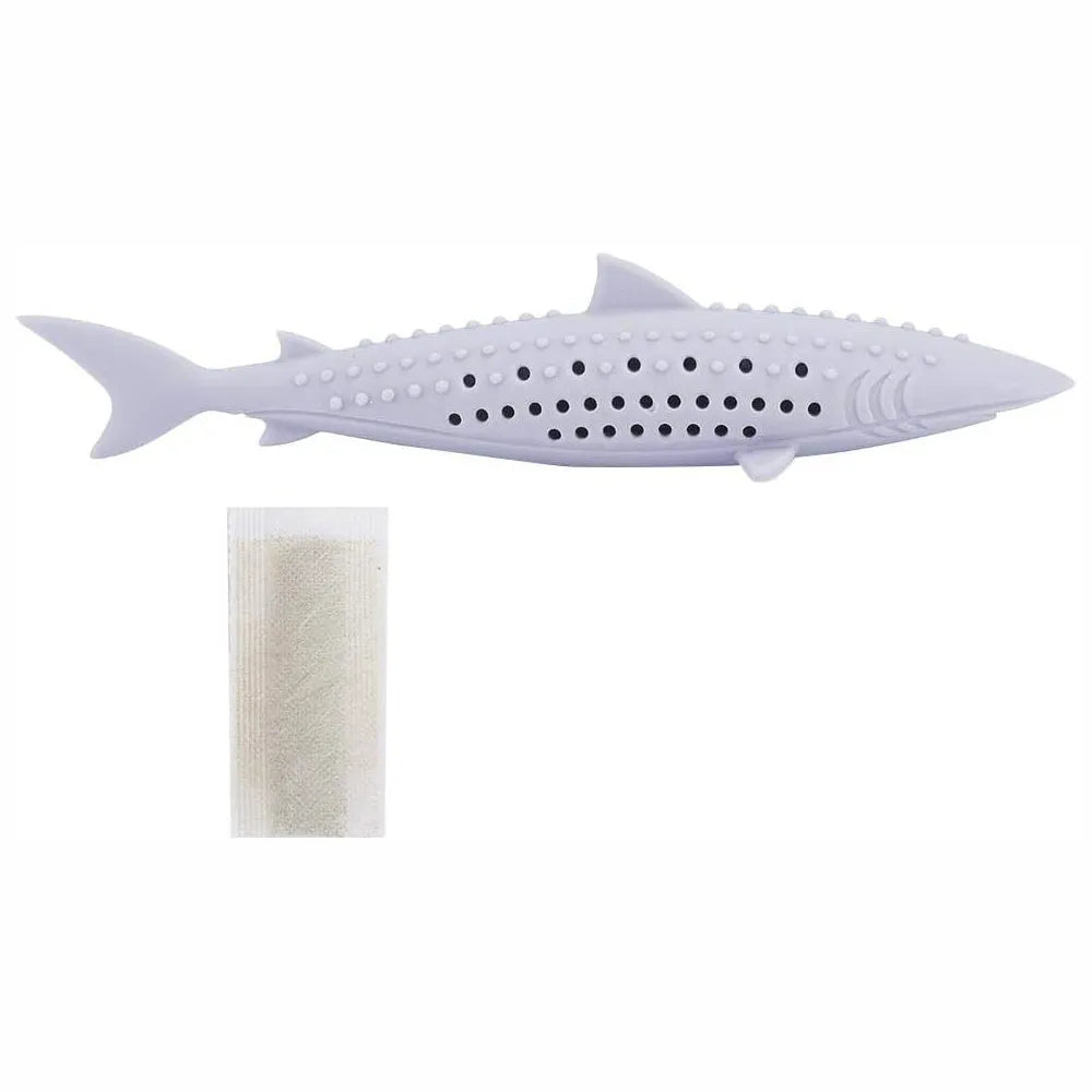 Green silicone fish-shaped cat chew toy with dolphin details and visible side holes.