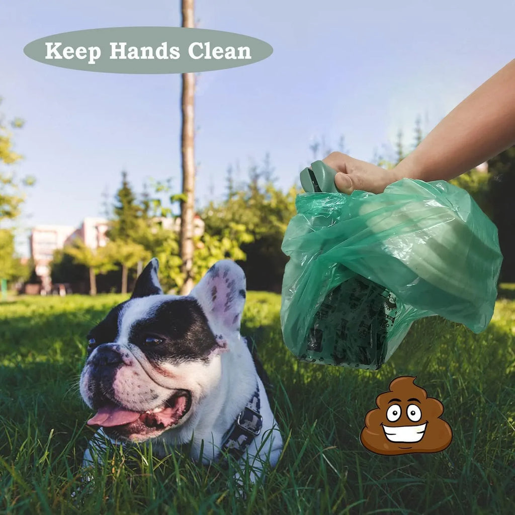 Portable handheld pooper scooper with integrated waste bag dispenser and carabiner clip attachment