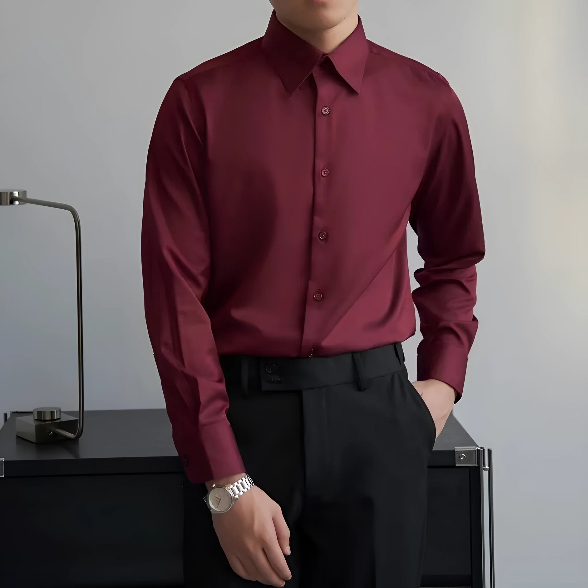 Man wearing a black loose-fit Korean style long sleeve cardigan shirt with Japanese retro design details.