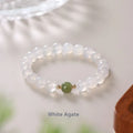 Handmade white agate and cinnabar crystal bracelet showing bead detail and inlay work