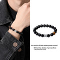 Men's obsidian bracelet with prayer wheel centrepiece and 10mm beads