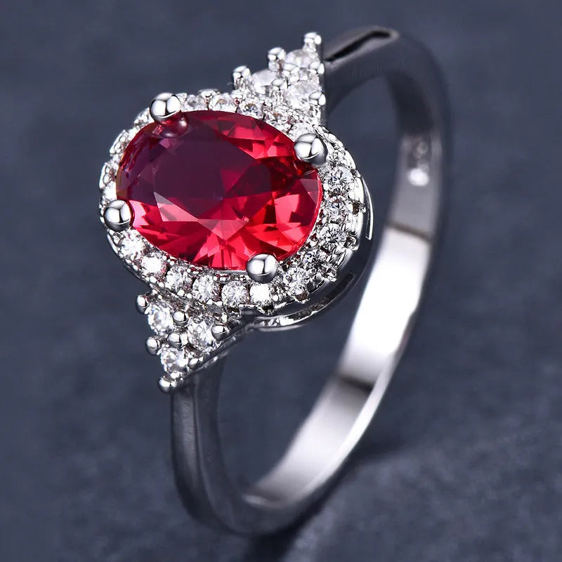 Adjustable oval ruby ring with copper open-mouth band, white gold colour finish, sizes 6 to 10