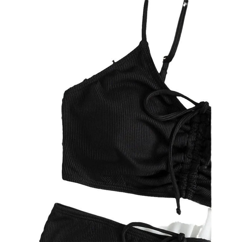 Black women's bikini swimsuit with high-waist shorts and sling split design.