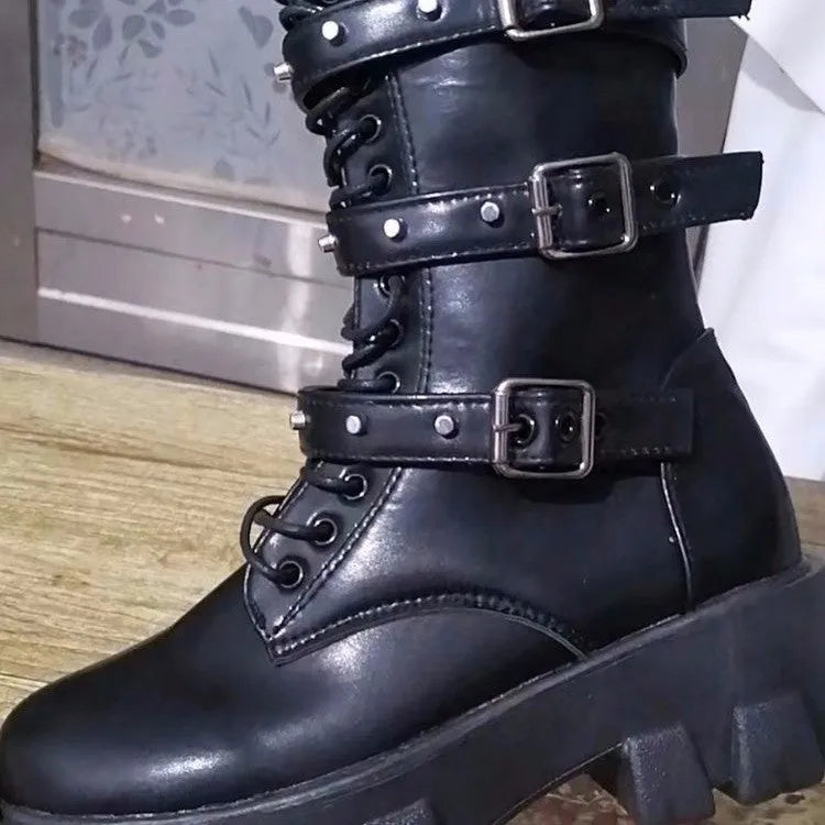 Women's black mid-calf buckle knight boots with side zip on a white background