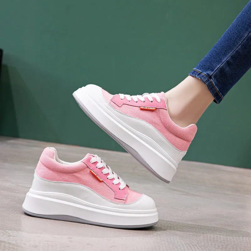 Women's pink leather board shoes with thick white soles on a neutral background