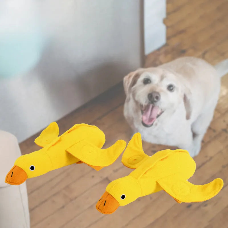 Yellow plush teddy dog toy with a duck squeaker and hidden treat pockets for training and chewing