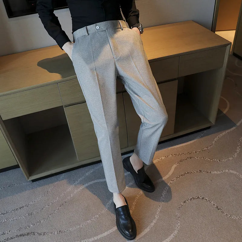 Straight cut brown corduroy trousers with elastic waistband shown front and back views