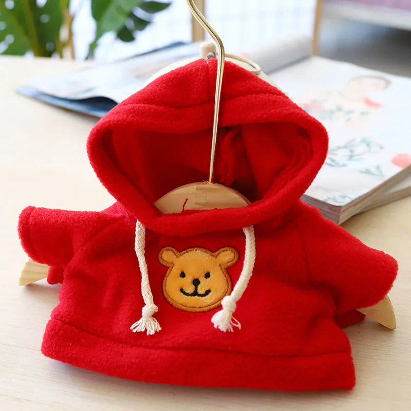Dog wearing a cloth balaclava hoodie sweater available in blue, pink, red, yellow, brown, or grey bear design