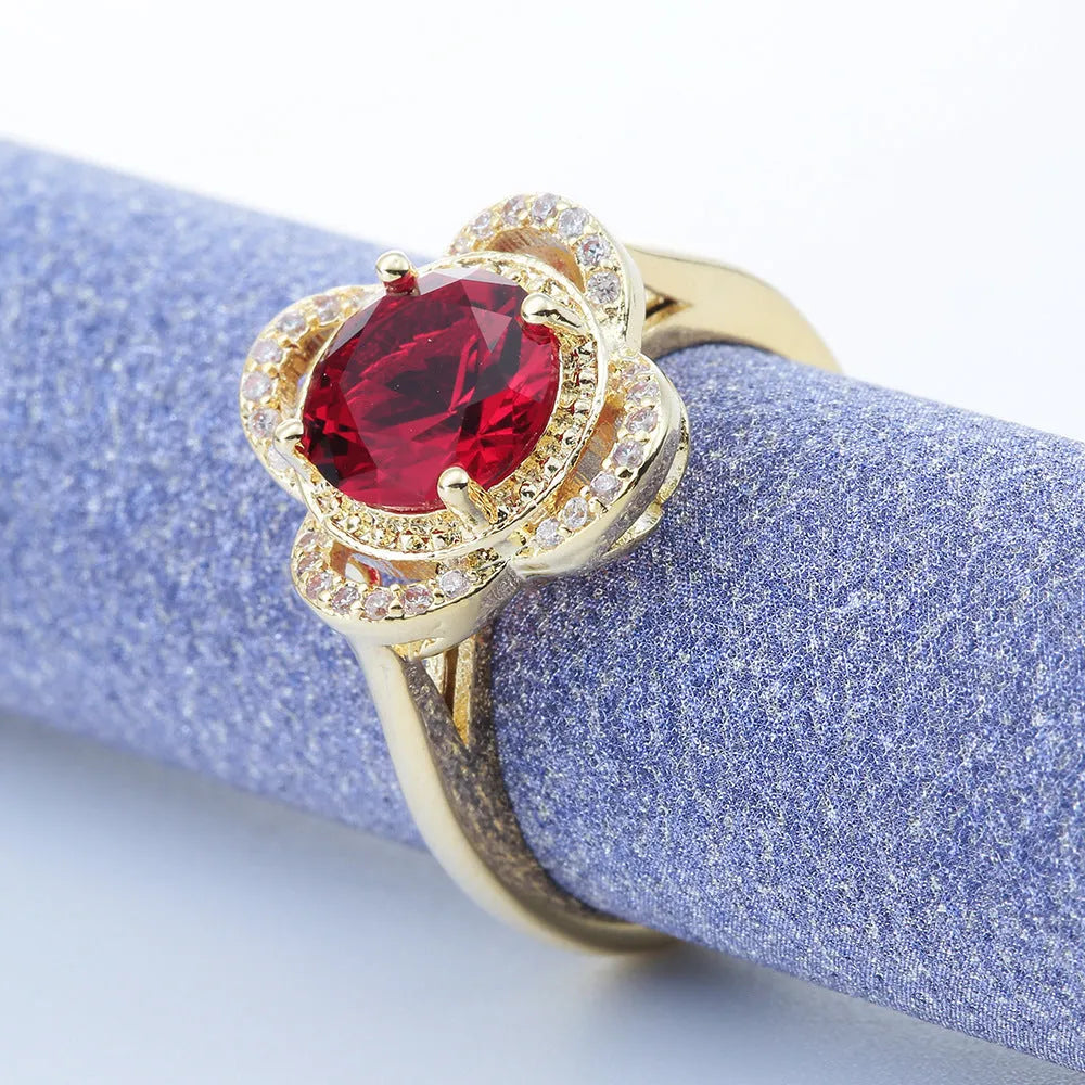 Copper ring with dark blue electroplated finish featuring zircon stones in fruit-shaped pattern