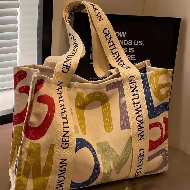 Canvas women's travel tote shoulder bag with printed design in large capacity format
